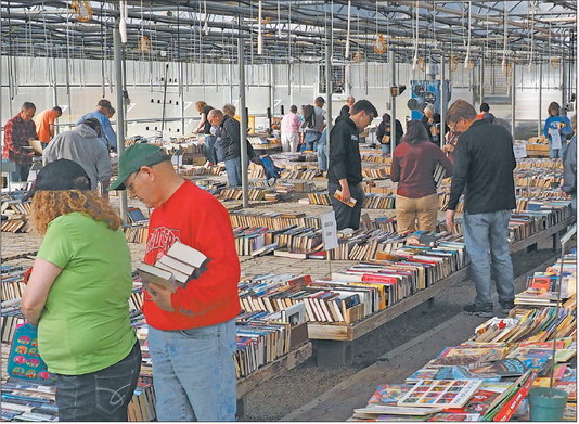 Boxes of books come, leave with literacy patrons