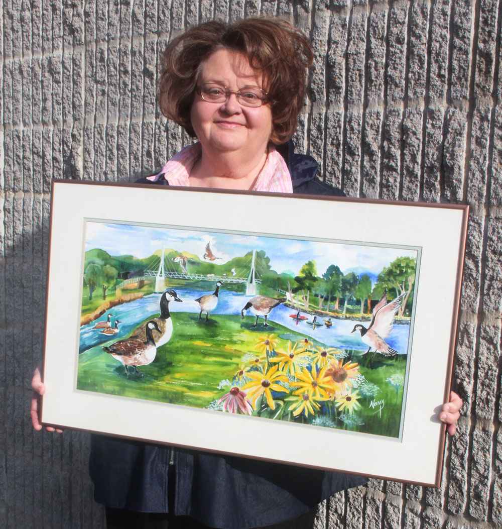 Artist donates watercolor to library in memory of sister-in-law