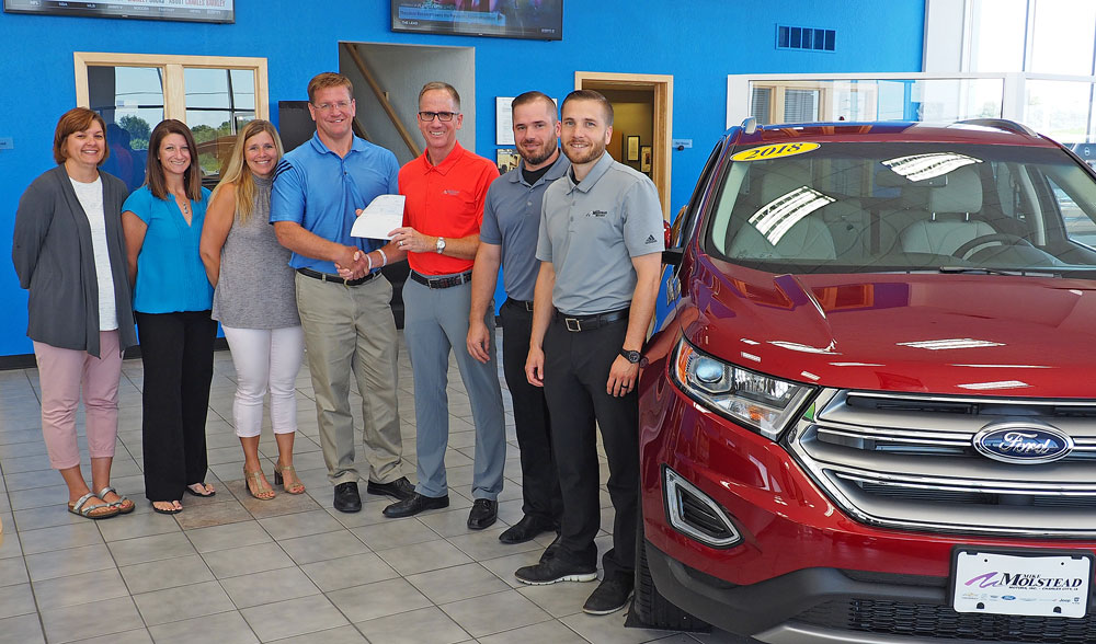 Car dealership, Booster Club work together to raise funds for school