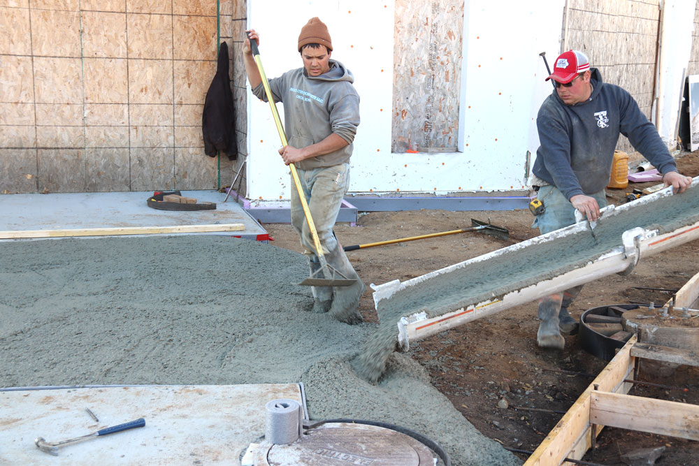 Work on McQuillen sidewalks continues