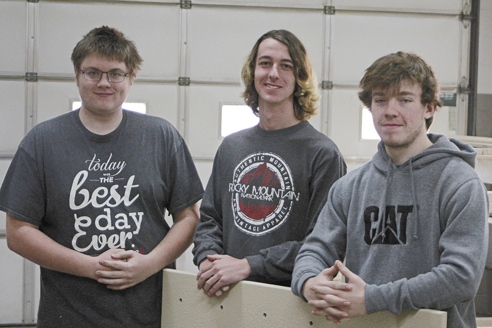 Charles City students work on building a rock-climbing wall
