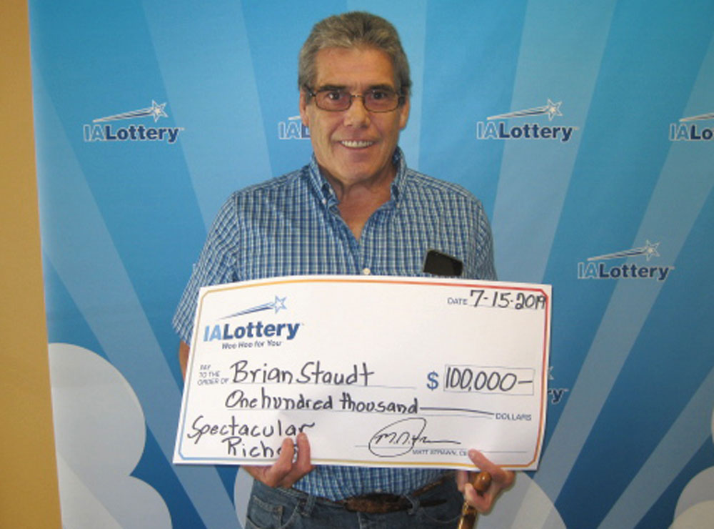 Charles City man plans dream trip after $100,000 scratch ticket win