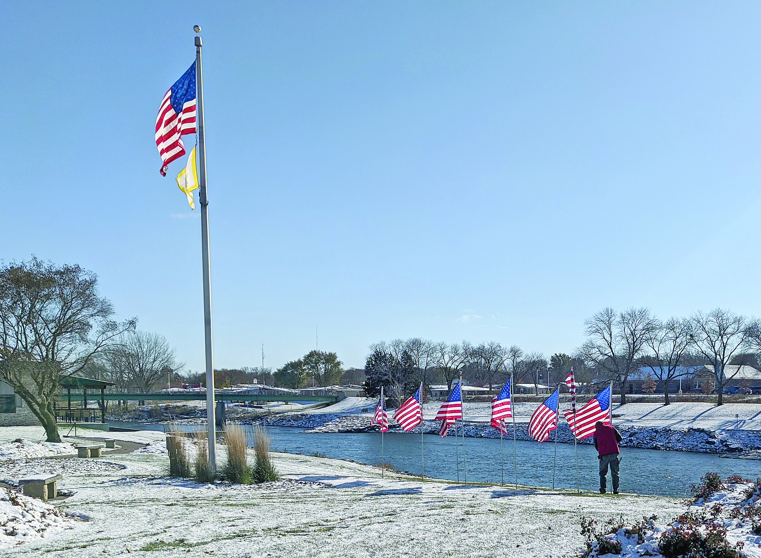 Early snow makes Veterans Day flag display a little more challenging