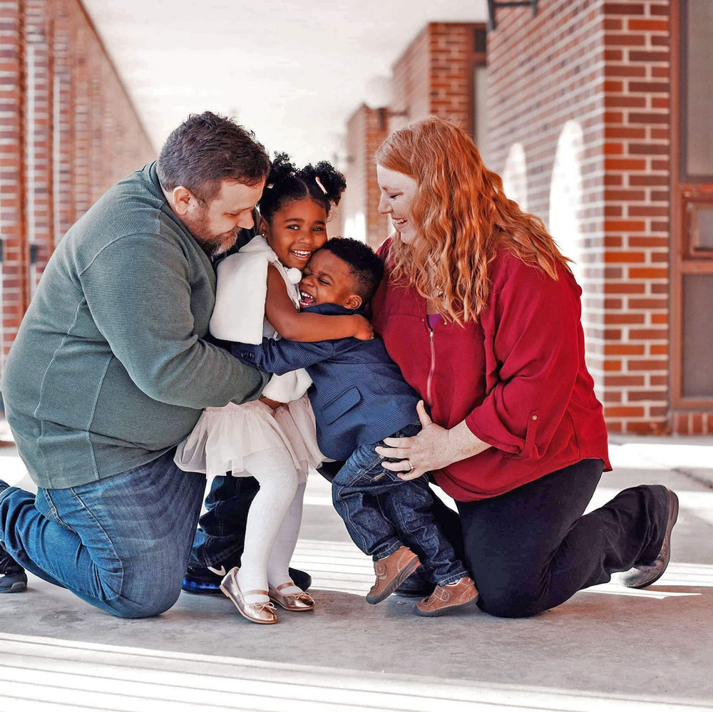 Two Charles City families see journey to adopt finalized on same day