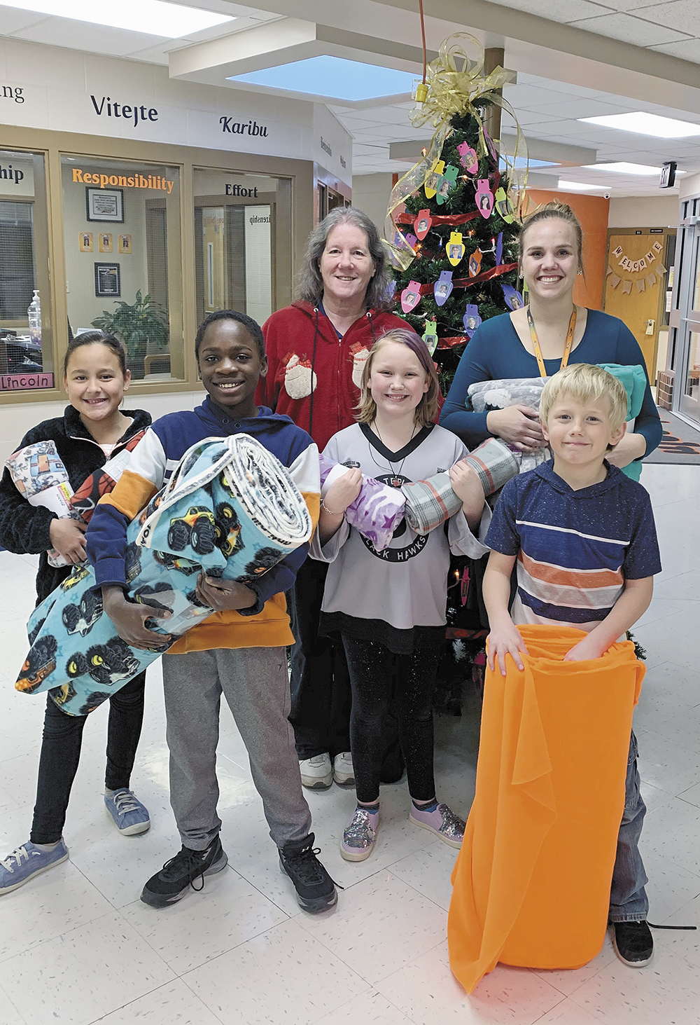 Elementary students make fleece blankets, donate them to the police