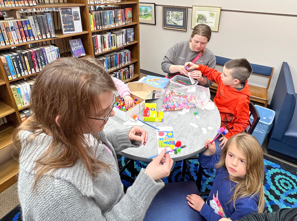 Hoards of kids enjoy loads of activities at Charles City Public Library’s Dr. Seuss birthday party