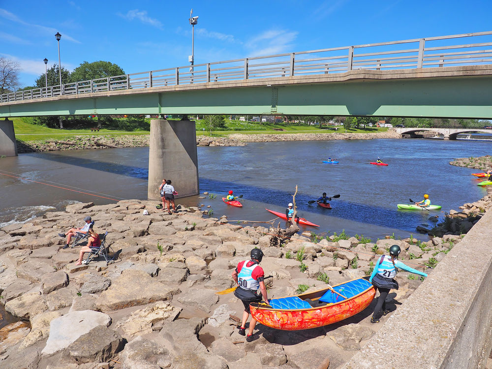 Summer Iowa Games Whitewater competitors have fun in quick current on Cedar River in Charles City