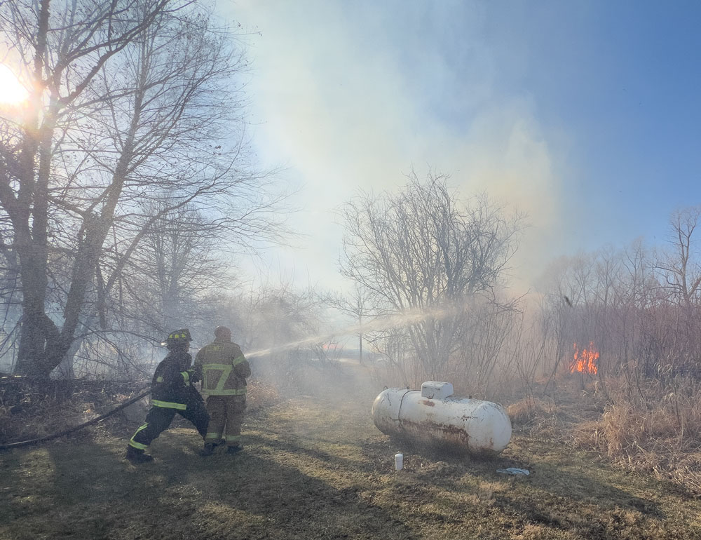 Ten departments join to fight wind-driven grass and brush fire north of Charles City Tuesday evening