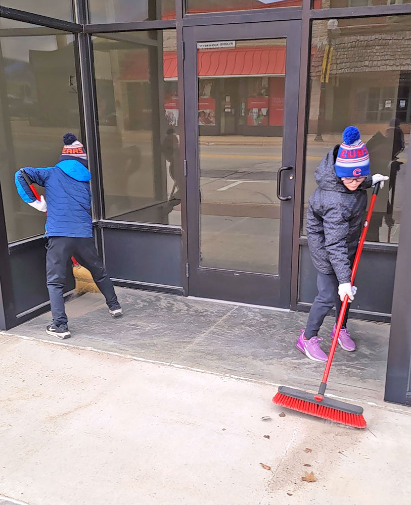 Volunteers sweep up Main Street