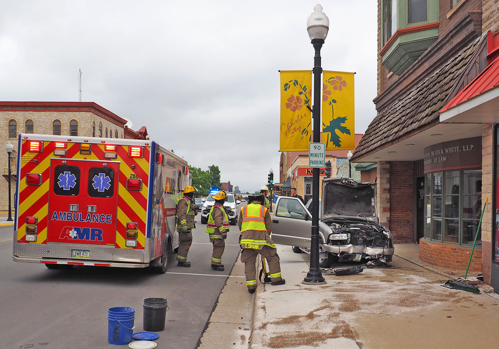 Driver injured breaking off Charles City Main Street street light